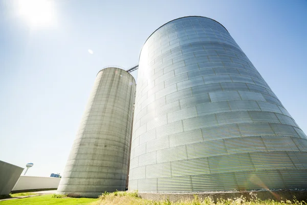 Silver, shiny agricultural silos — Stock Photo, Image