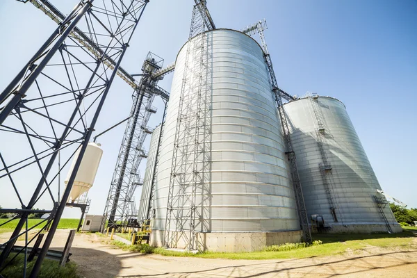 Silver, shiny agricultural silos — Stock Photo, Image