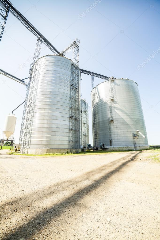 Silver, shiny agricultural silos