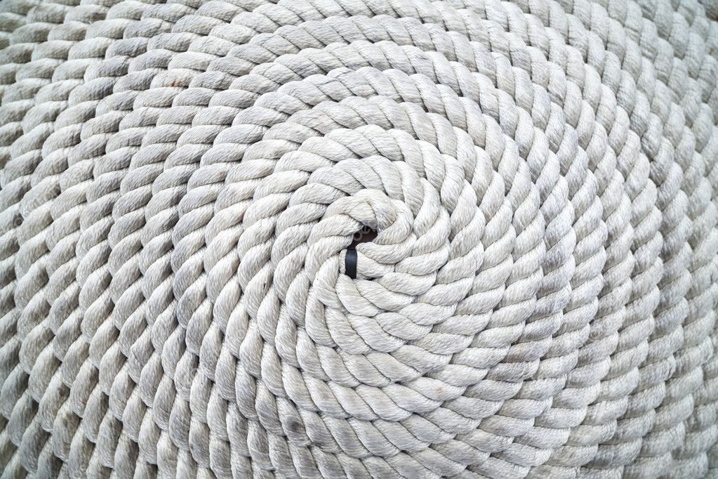 Rope coiled on dock 