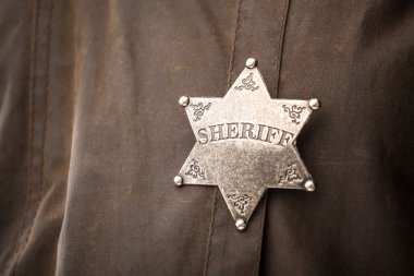 Close up of sheriff badge clipart