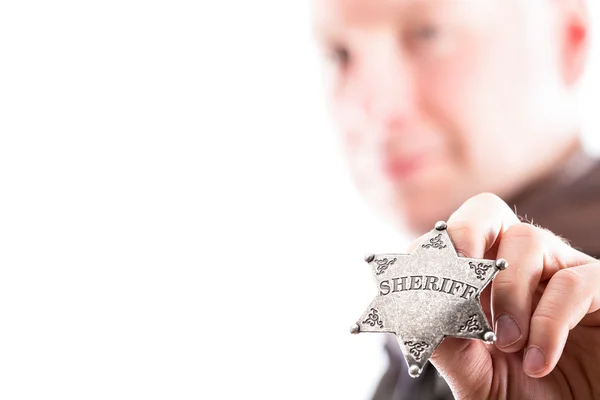 Man holds sheriff badge — Stock Photo, Image