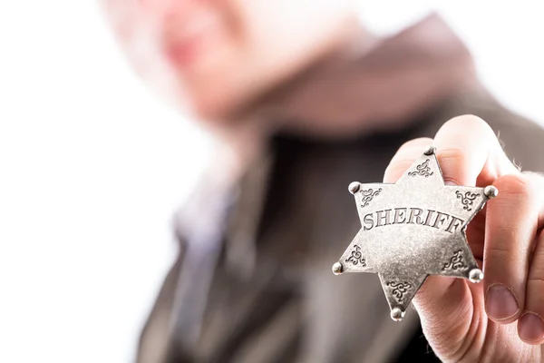 Man holds sheriff badge — Stock Photo, Image