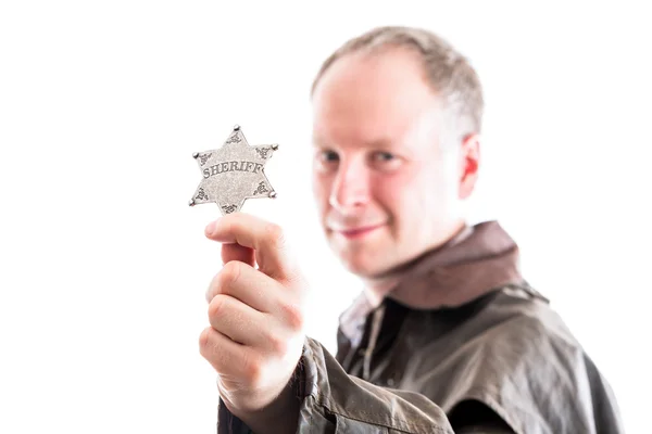 Man holds sheriff badge — Stock Photo, Image