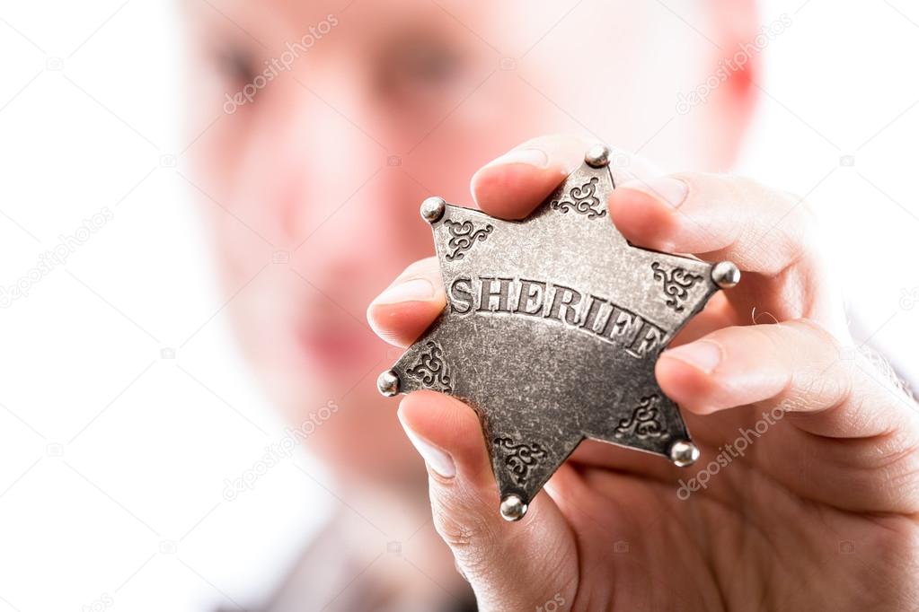 Man holds sheriff badge