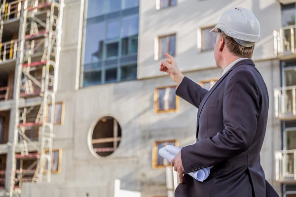 Construction manager with blueprints — Stock Photo, Image