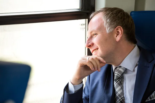 Businessman enjoying his train journey — Stock Photo, Image