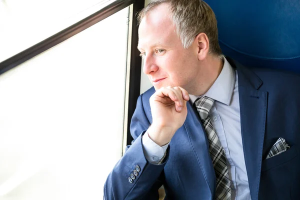 Businessman enjoying his train journey — Stock Photo, Image