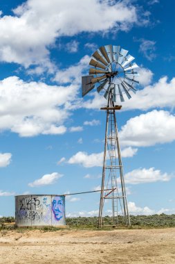Windmill and beautiful blue sky, USA. clipart