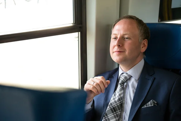 Businessman enjoying his train journey — Stock Photo, Image