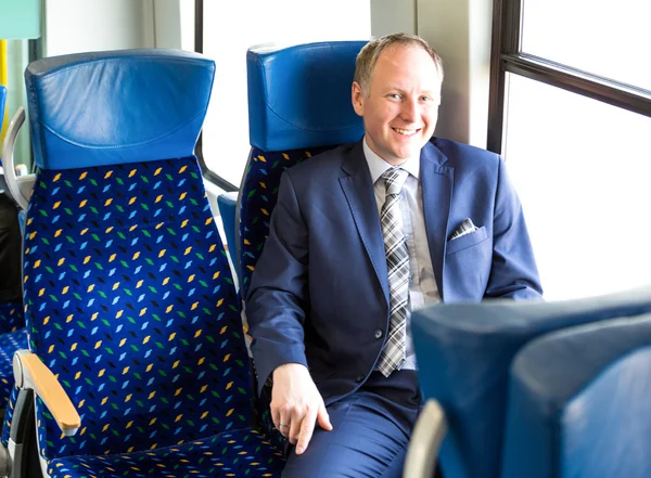 Businessman sitting in a train — Stock Photo, Image