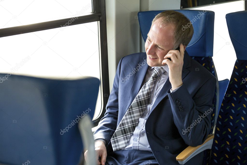 Businessman calling from a train