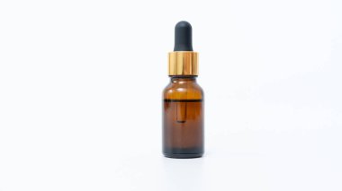 Amber glass dropper bottle featuring a gold cap, set against a clean white background, perfect for showcasing essential oils or cosmetic products