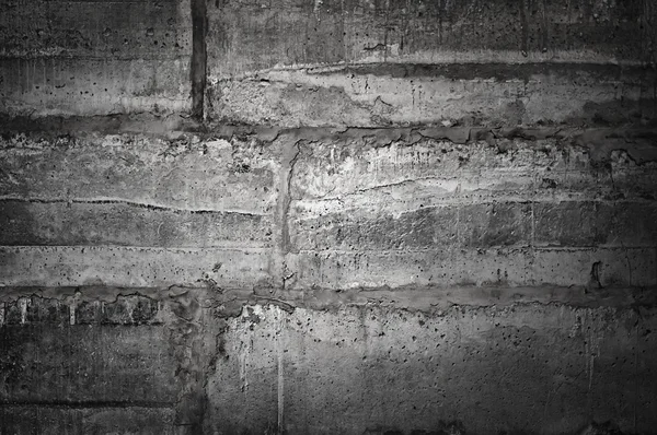 Parede de concreto escuro com gesso. Textura grunge . — Fotografia de Stock