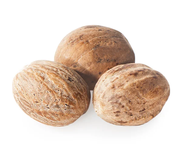 Nutmeg on a white background close-up. — Stock Photo, Image