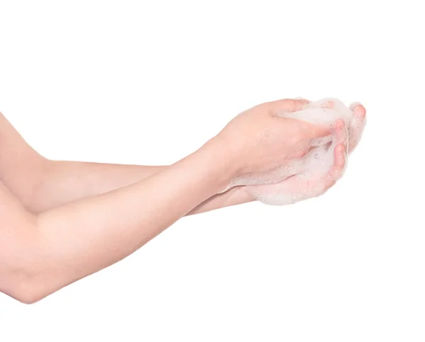 Hermosas manos femeninas enjabonadas aisladas en blanco . — Foto de Stock