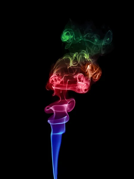 Colored smoke on a black background. — Stock Photo, Image