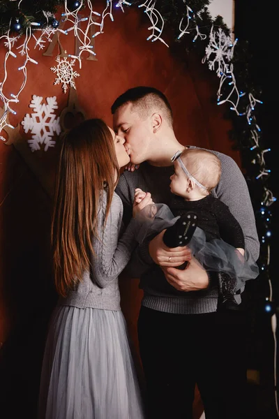 Cute Young Family Dad Mom Baby Daughter Hugging Kissing Christmas — Stock Photo, Image