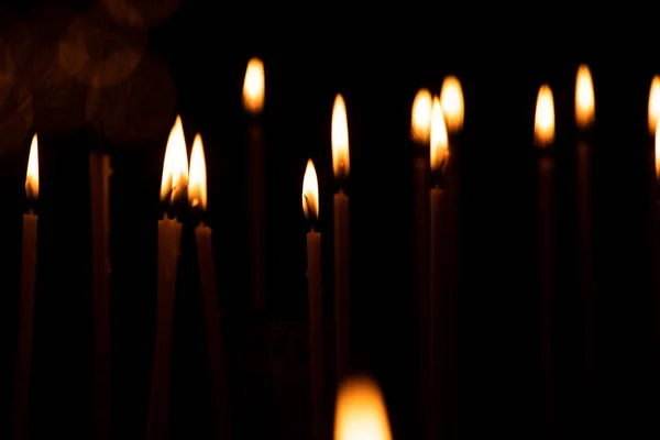 Close Lot Burning Candles Isolated Black Background — Stock Photo, Image