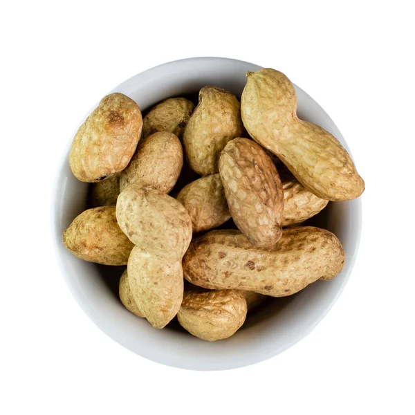 白い背景に白いセラミックボウルにシェル内のピーナッツ トップビュー フラットレイアウト — ストック写真