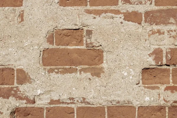 破壊された石膏と古いレンガの壁の質感 背景や背景としての古典的なレンガ造り — ストック写真