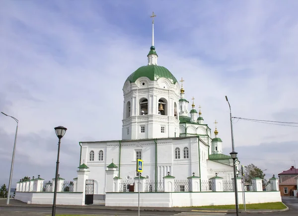 Ancient orthodox architecture. Epiphany Church in Eniseisk. Blurry sky with clouds.