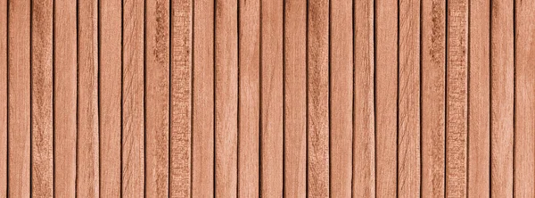 Texture of a wooden table from narrow planks, top view.