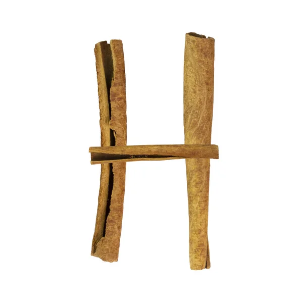 シナモンフォント 手紙Hは 白で隔離されたシナモンの破片から作られています スパイスから設定されたアルファベット文字フォント — ストック写真