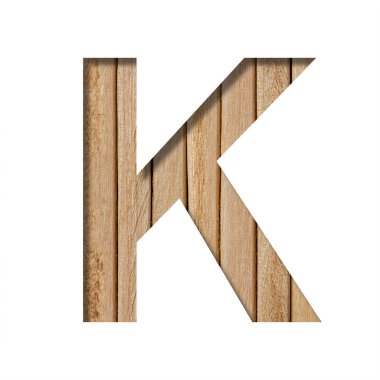 Işık tahtasındaki yazı tipi. K harfi, dikey ahşap bir zeminde kağıttan kesilir. Tahta yazı tipleri kümesi