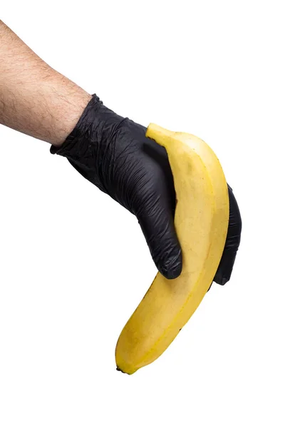 Banana Amarela Madura Brilhante Mão Homem Uma Luva Preta Isolada — Fotografia de Stock