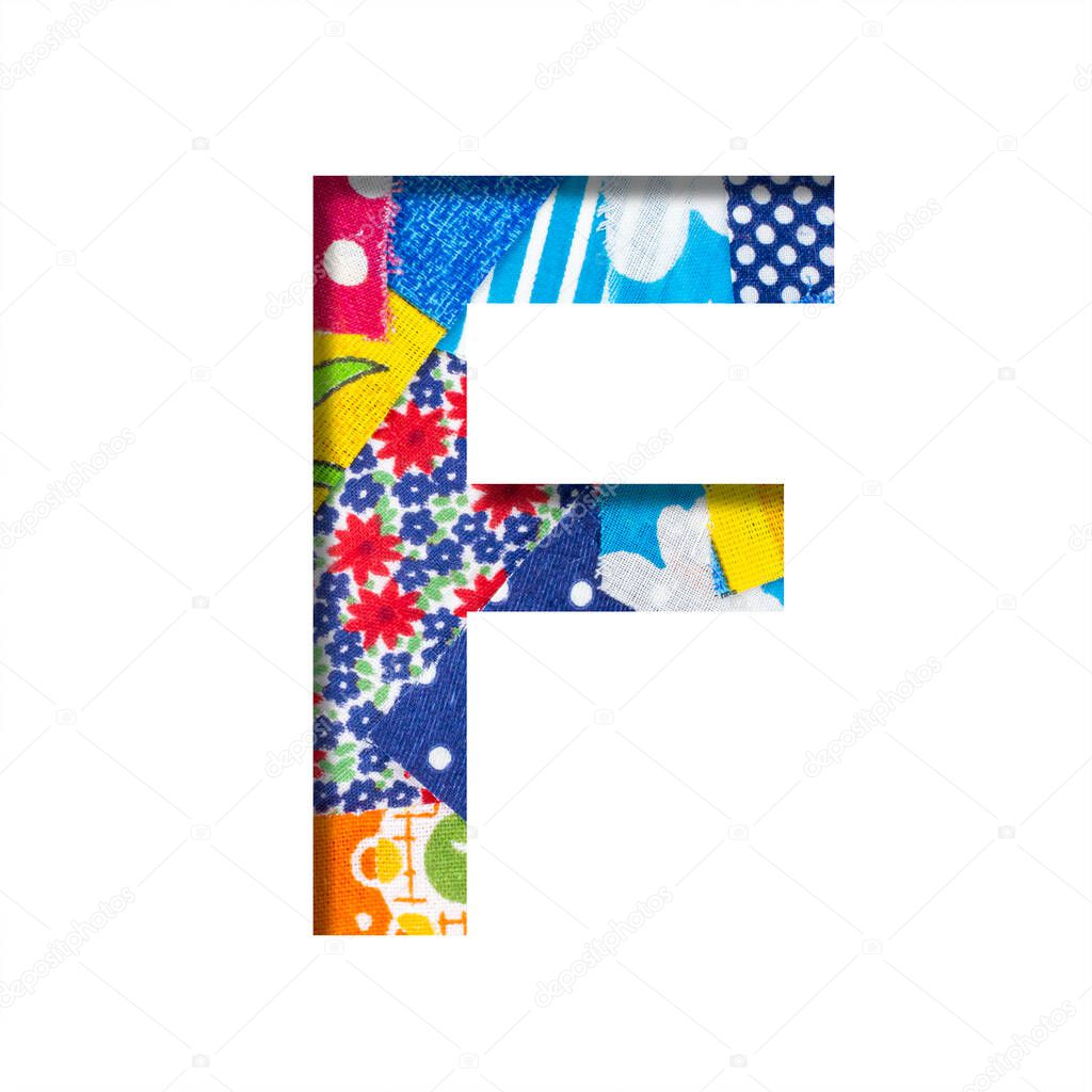 Handicraft or creative font. The letter F cut out of paper on the background of the texture of pieces of colored fabrics for home creativity or needlework. Set of decorative fonts.