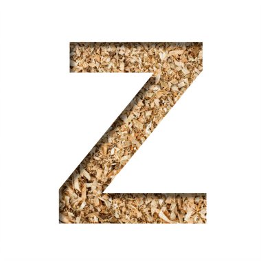 Tahta talaşı yazı tipi. Z harfi, arka planda talaş ya da meyve ağacı talaşlarının olduğu kağıttan kesilmiş. El yapımı veya küçük üretim için dekoratif alfabe, yazı tipi koleksiyonu.