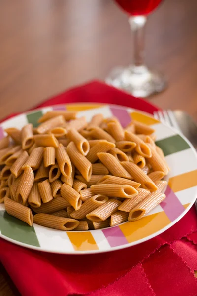 Macaroni  on table and red napkin — Stock Photo, Image