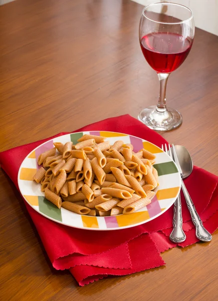 Macaroni  on table and red napkin — Stock Photo, Image