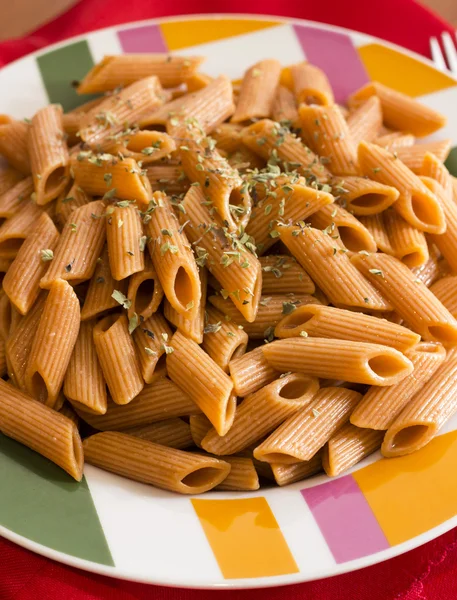 Macaroni  on table and red napkin — Stock Photo, Image