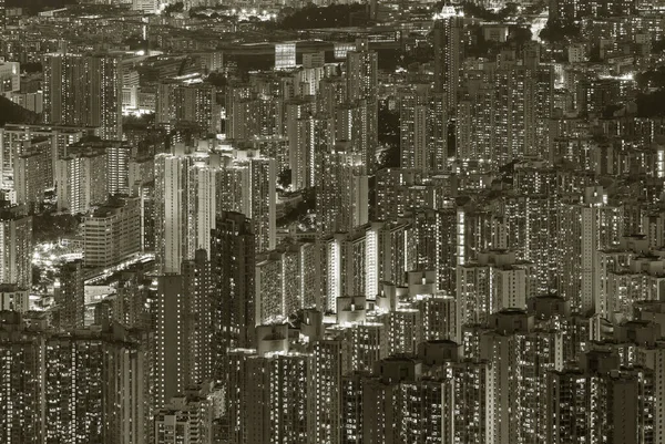 Aerial view of crowded residential building in Hong Kong city at night