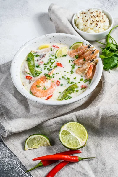 Homemade Tom Kha Gai. Coconut Milk soup in a bowl. Thai food. gray background. Top view — Stock Photo, Image