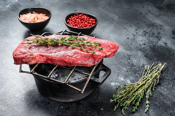 Raw Sirloin steak, beef meat. Dark Wooden background. Top view