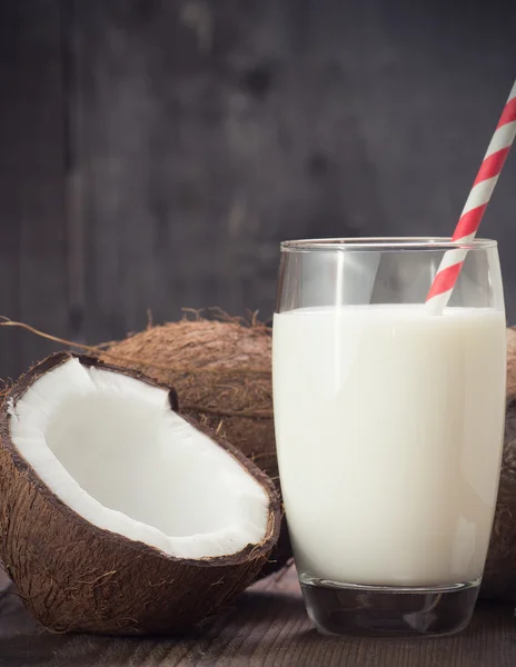 Coconut Milk in a glass on dark wooden background — Stock Photo, Image