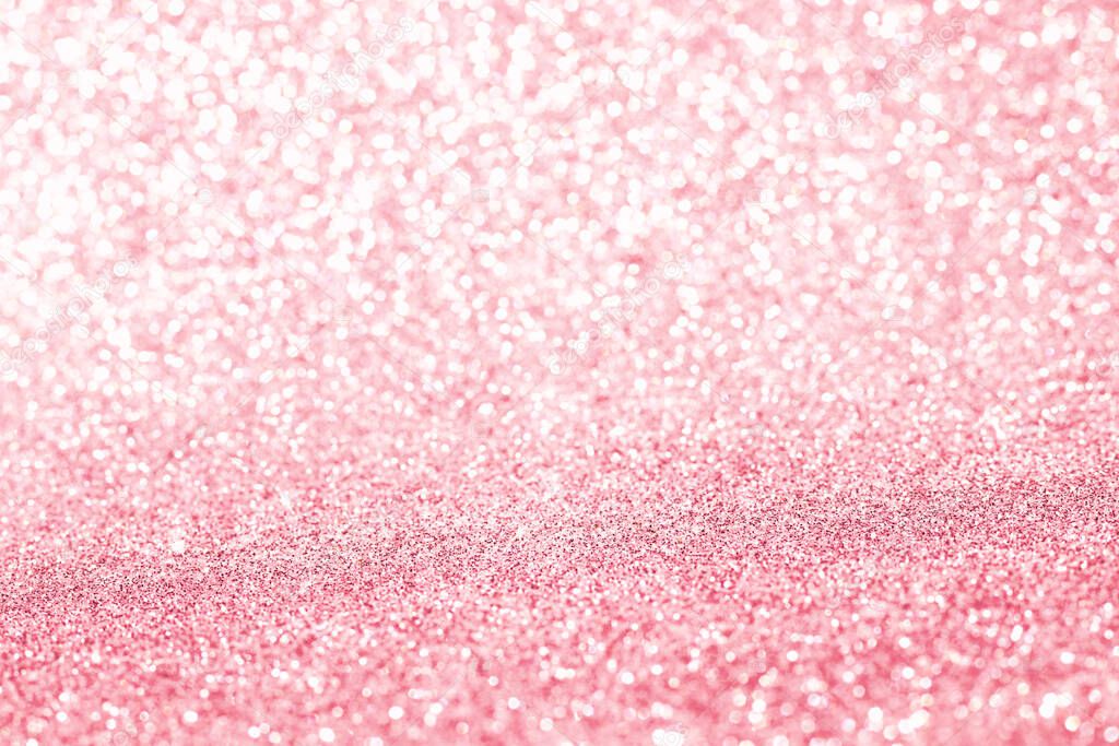 Shiny blurred pink background with bokeh for a festive mood. Greeting card template for entertainment. Blurry bokeh