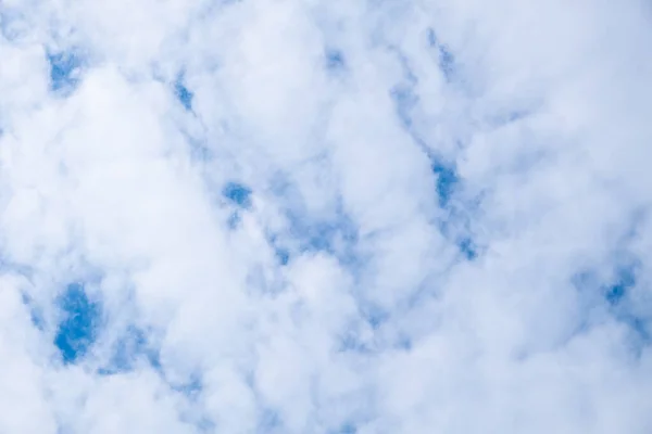 Airy porous clouds on the sky with copy space, white sky background — Stock Photo, Image