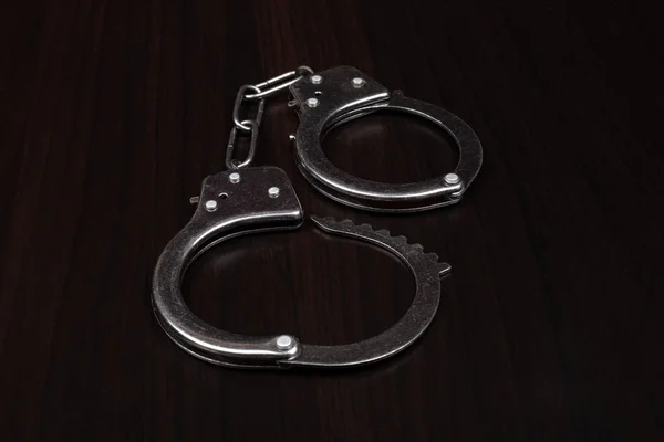 Handcuffs Dark Background Closeup — Fotografia de Stock