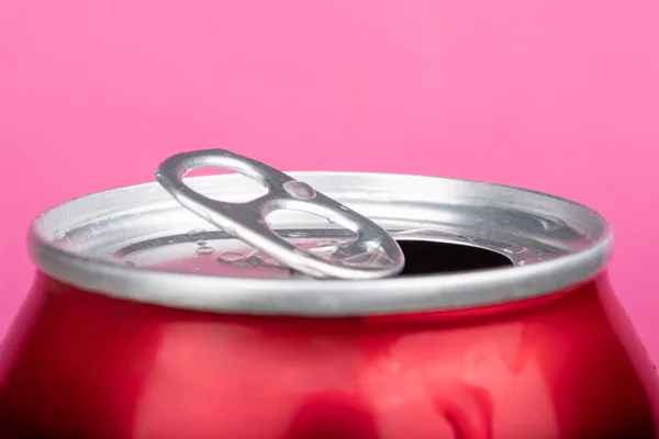 Open red can tin of beer close up on pink background — Stock Photo, Image