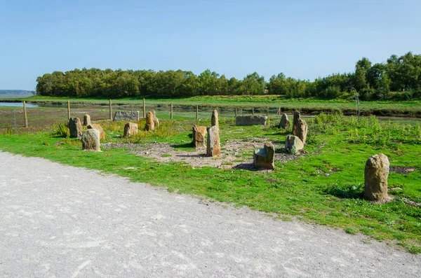 A modern stone circle beside the North Wales Coastal Path where it passes around the disused Flint Dock