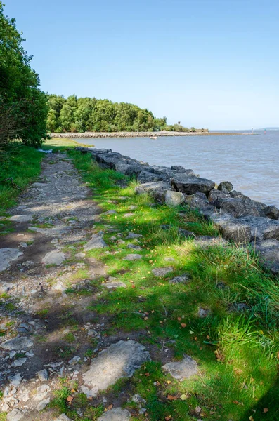 High tide at Flint Foreshore on the River Dee in North Wales following the route of the North Wales Coastal Path