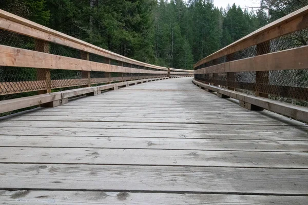 Wooden foot bridge known as the Todd Creek Trestle in Sooke, British Columbia on the Galloping Goose Trail