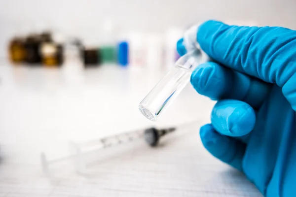 Doctors hands in blue robber gloves — Stock Photo, Image