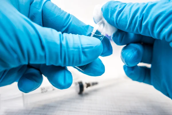 Doctors hands in blue robber gloves — Stock Photo, Image