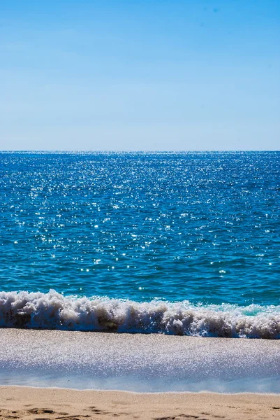 Zandstrand en zee — Stockfoto