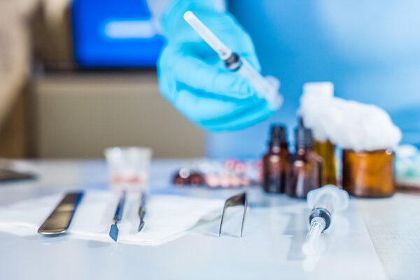 Syringe with glass vials and medications pills drug